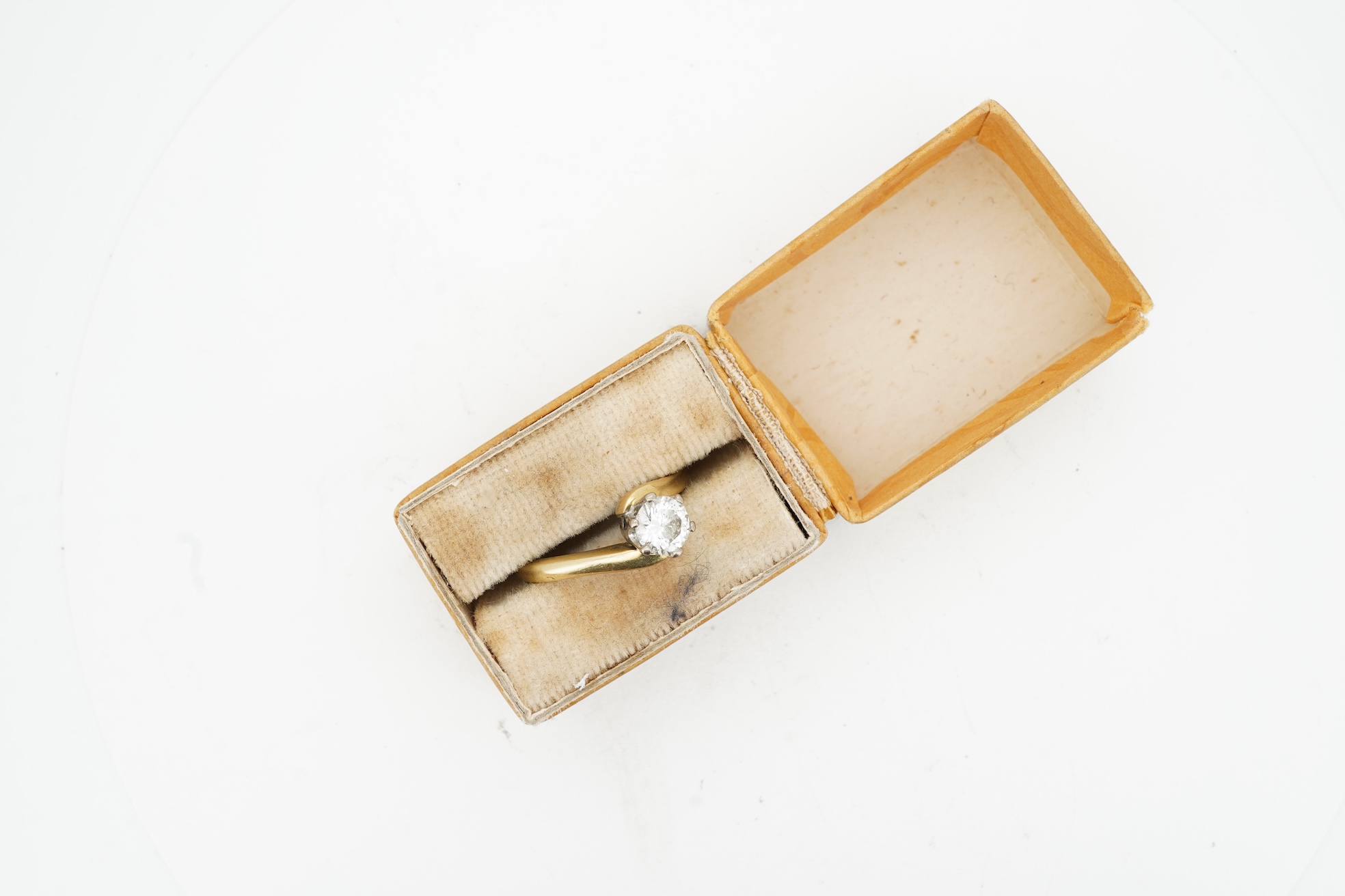 A diamond solitaire ring, claw-set with a brilliant-cut diamond weighing approximately 0.50 carats, to an symmetrical 18ct gold mount, size I, British hallmarks, gross weight approximately 3 grams